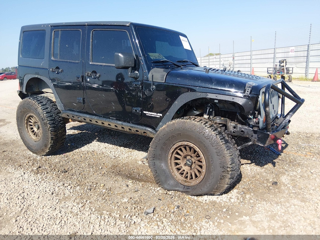 Вид 2012 Jeep Wrangler Unlimited Sport, угол 1