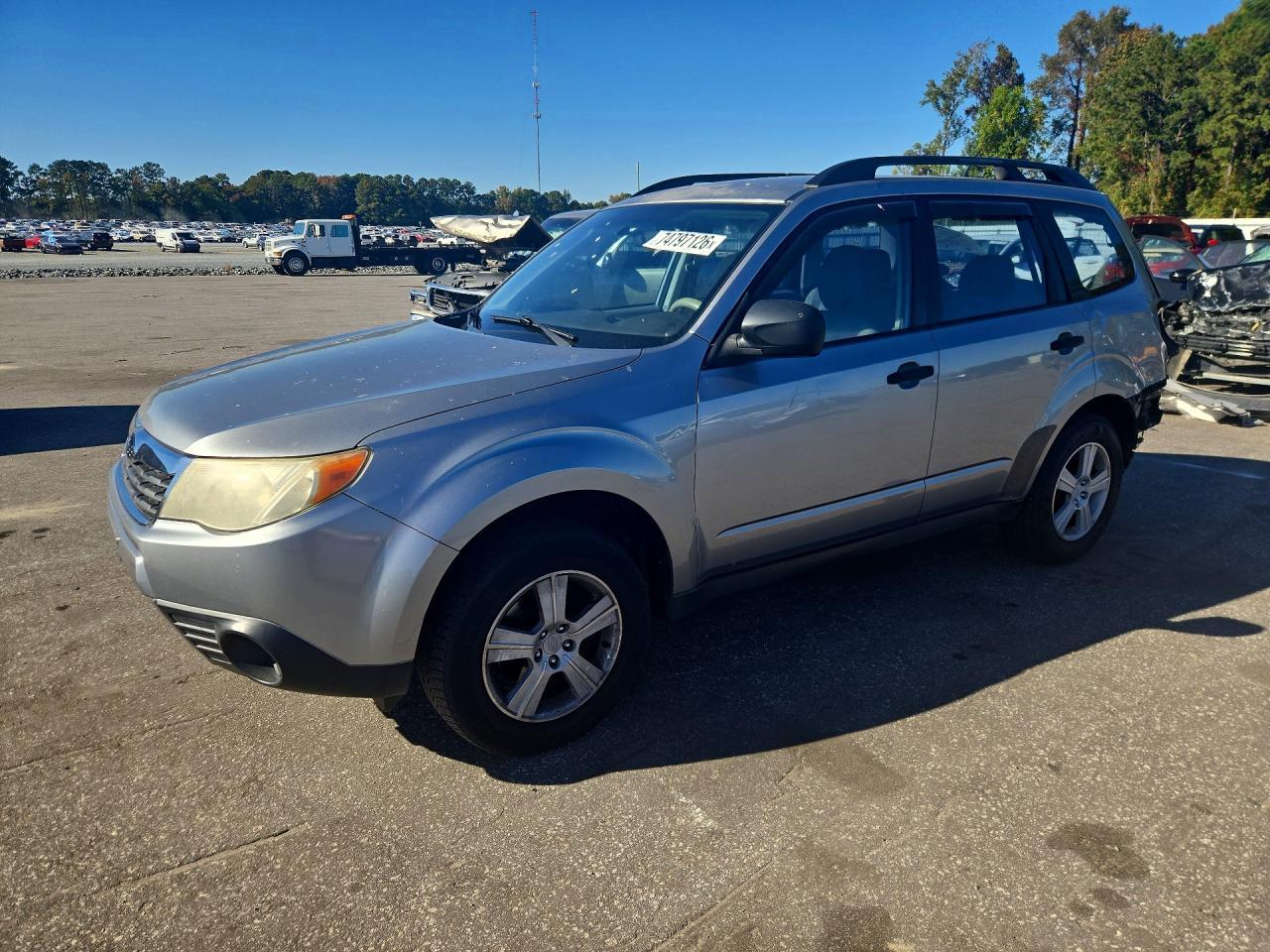 منظر 2010 SUBARU FORESTER XS، زاوية 1
